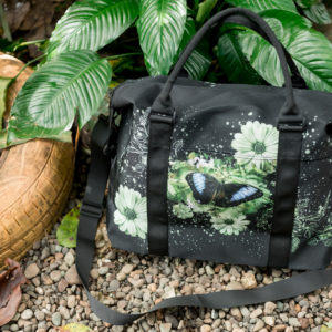 lifestyle image of blue morpho butterfly travel bag