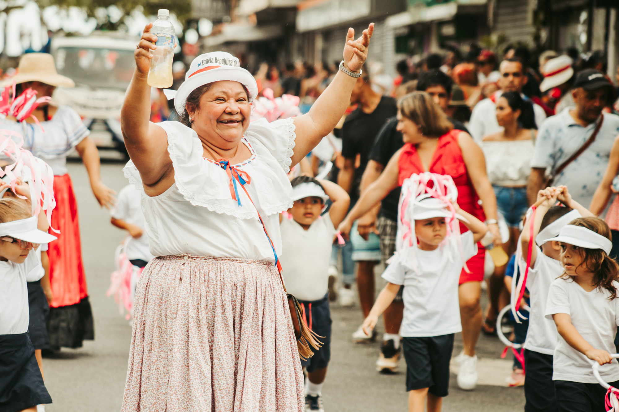 old woman smiles and celebrates at the Indepedence day parade