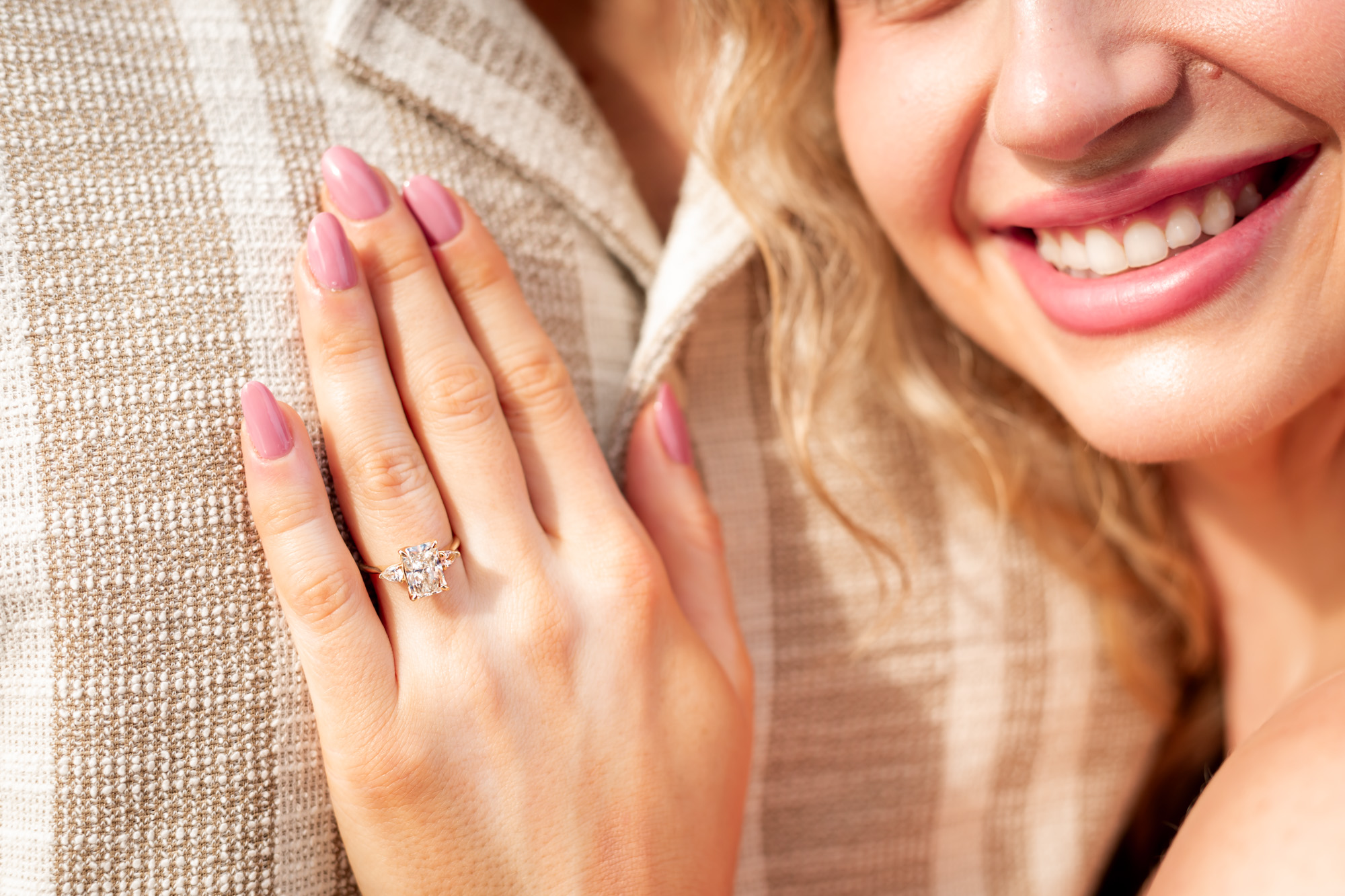 Newly engaged couple on the beach