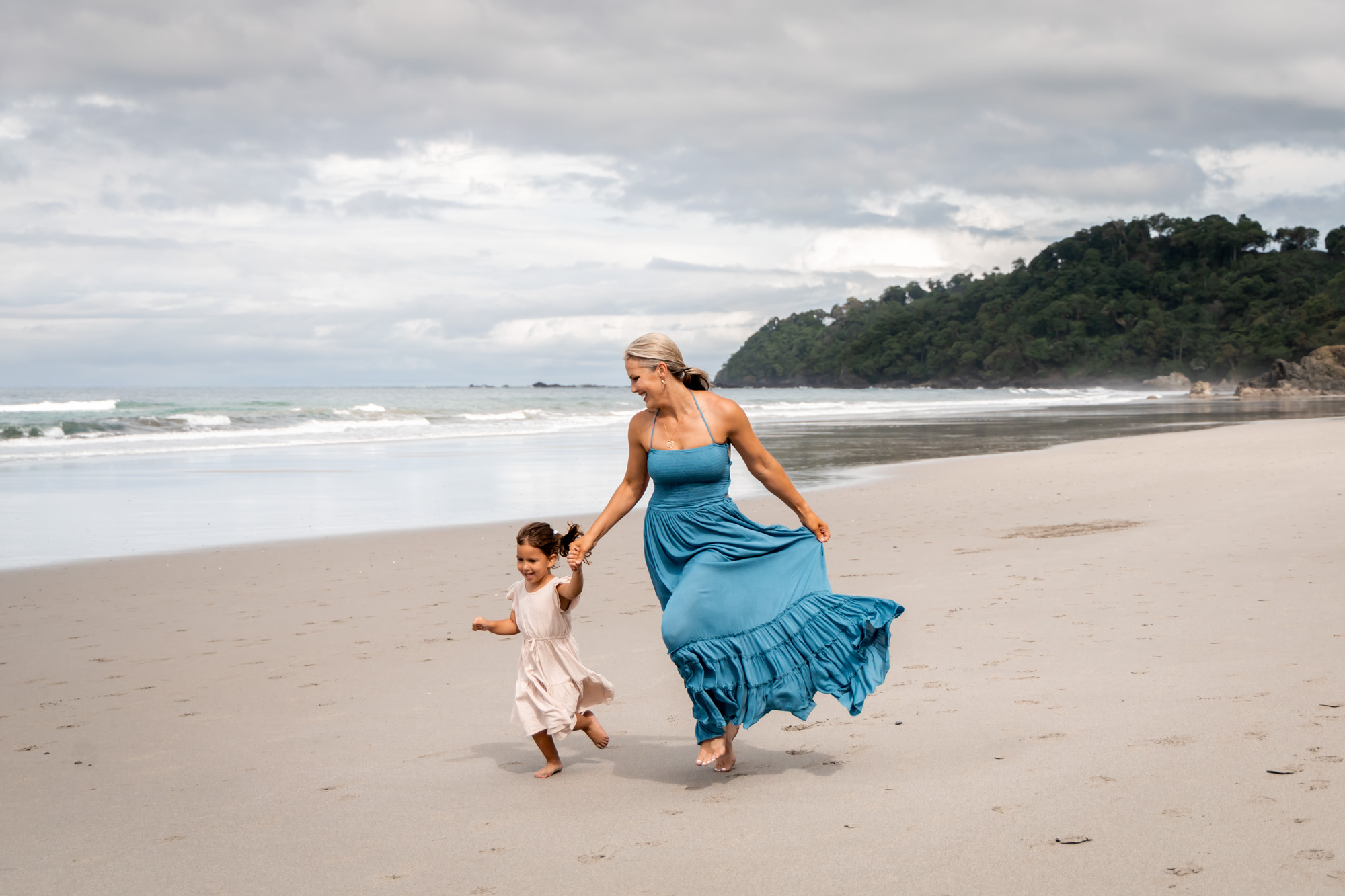 family photography costa rica - toddler playing with a baby chick